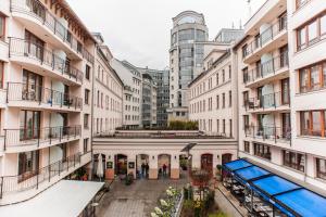 an empty street in a city with tall buildings at Mango Apartments in Budapest