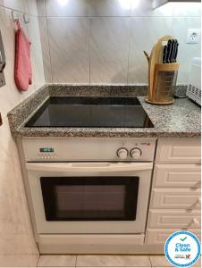 a white stove top oven in a kitchen at Oporto Cavadas House in Porto