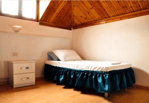 Postel nebo postele na pokoji v ubytování Tirana Central GuestHouse