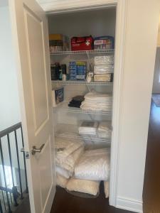 a closet filled with lots of towels at Relax, Refresh and Recharge Peaceful Space in Bradford