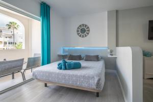 Łóżko lub łóżka w pokoju w obiekcie La Perla del Sur - The Pearl House