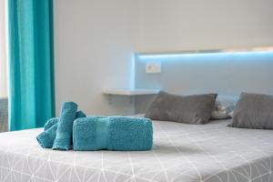 Łóżko lub łóżka w pokoju w obiekcie La Perla del Sur - The Pearl House