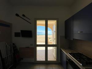 Kuchyň nebo kuchyňský kout v ubytování Veranda sul mare di Donnalucata