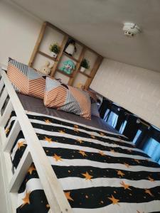 a bedroom with a bunk bed with stars on it at Studio type Good for 2 Near Megamall in Manila