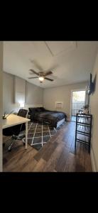 a bedroom with a bed and a ceiling fan at Lopez Place in Tampa