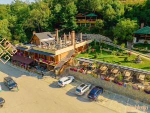 an aerial view of a hotel with cars parked in a parking lot at HotelRestaurant Gështenja in Suharekë