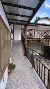 a balcony of a house with a tile floor at Centro de Gramado in Gramado