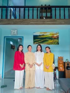 a group of four women standing in a room at Tứn' Home in Tây Ninh