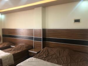Postel nebo postele na pokoji v ubytování Al Deyafa Hotel