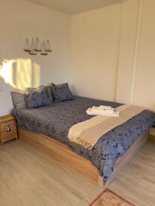 a bedroom with a large bed in a room at GOLDEN HOUR Beachfront apartment Marbella in Marbella