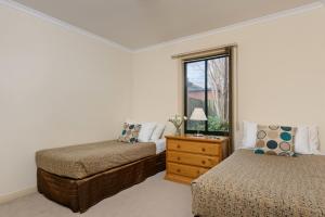 a bedroom with two beds and a window at Park Avenue - Forest Hill in Forest Hill