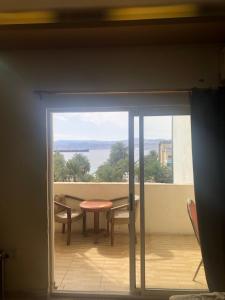 a view of a balcony with a table and chairs at Al Deyafa Hotel in Aqaba