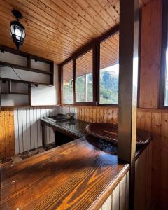 a kitchen with a counter and a sink in a room at Juta Guest House in Jut'a