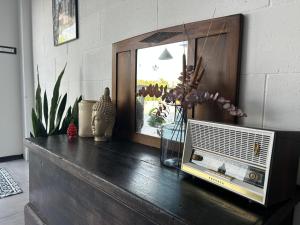 a wooden dresser with a television on top of it at 87029house in Scalea