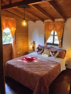 a bedroom with a large bed in a room with windows at el diamante: Magic night in Santa Elena