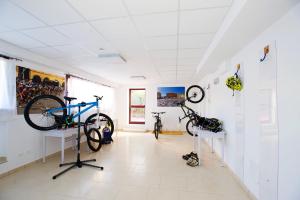 a room with bikes on display on the walls at Ligure Residence in Pietra Ligure +54 photos