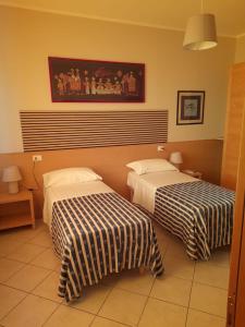 Postel nebo postele na pokoji v ubytování vasco rent rooms
