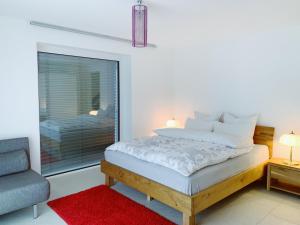 Postel nebo postele na pokoji v ubytování N1 Standalone House Baden