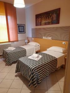 Postel nebo postele na pokoji v ubytování vasco rent rooms