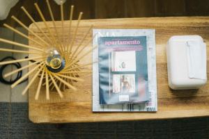 a table with a book and a pair of scissors at 無處 Nowhere Retreat 獨棟空間 in Yilan City