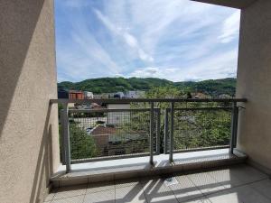 a balcony with a view of a city at Iva Lux stan na dan in Banja Luka