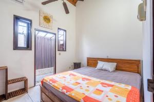 Postel nebo postele na pokoji v ubytování Surya Villa Manggis