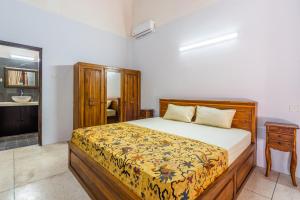 Postel nebo postele na pokoji v ubytování Surya Villa Manggis