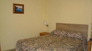 Postel nebo postele na pokoji v ubytování Hotel Durazno