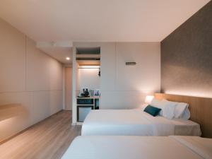 Postel nebo postele na pokoji v ubytování 56 Hotel