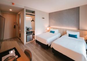 Postel nebo postele na pokoji v ubytování 56 Hotel