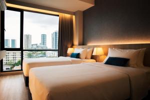 Postel nebo postele na pokoji v ubytování 56 Hotel