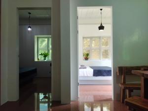 a room with a bed and a window at Balai ni Meno in Butuan