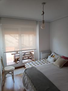 Postel nebo postele na pokoji v ubytování Apartamento con terraza