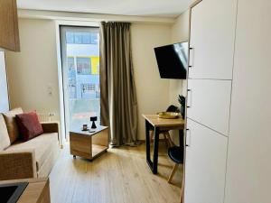 TV a/nebo společenská místnost v ubytování MYAPPARTEMENT