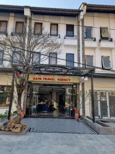 a store front of a building with aasy travel agency at Sapa Tay Bac Home in Sa Pa