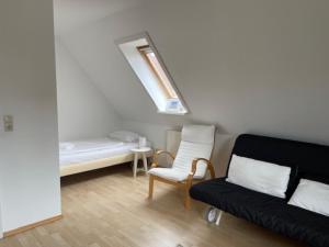 מיטה או מיטות בחדר ב-Anke Hoppe
