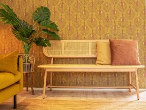 a bench with two pillows on it in a room at Stayatsas Tiny House Julia in de bossen op de Veluwe! in Epe