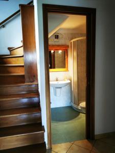 a bathroom with a tub and a sink and a toilet at La Quiete nel verde in Boves