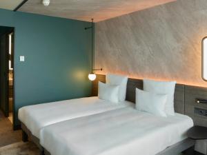 Novotel Bern Expo客房内的一张或多张床位