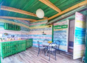 a dining room with a table and chairs at RAINBOW HOME in Gornji Štoj