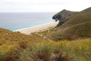 a view of the beach from a hill at Apartamento Completo Supreme Suite in Carboneras