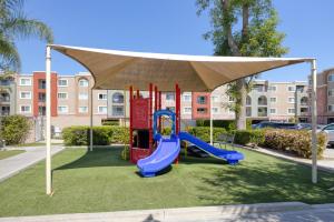 a playground with a slide and a canopy at Woodland Hills 1br w pool gym nr Warner Center LAX-894 in Los Angeles