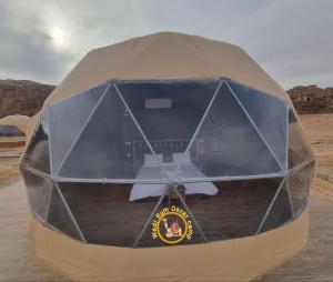 a tent in the middle of the desert at Wadi Rum Oscar camp in Wadi Rum