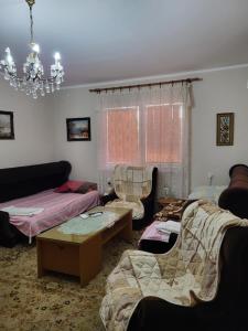 Postel nebo postele na pokoji v ubytování Kaza apartment