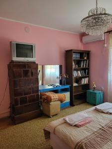 Postel nebo postele na pokoji v ubytování Kaza apartment