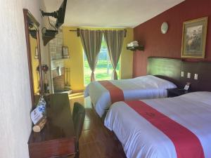 Llit o llits en una habitació de Hotel Campestre Imperial