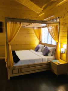 Krevet ili kreveti u jedinici u objektu Brahmi Resort
