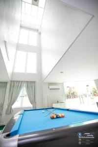 a pool table with balls on it in a room at GeorgeTown 6BR KTV Bungalow 28Pax in George Town