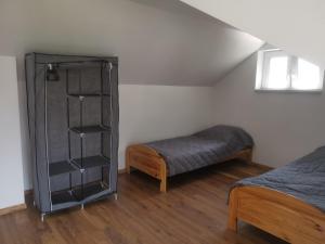 A bed or beds in a room at Domek z basenem przy Willi Cichej Rabka
