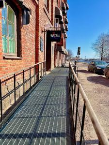 a sidewalk in front of a brick building at Hotell Alderholmen in Gävle